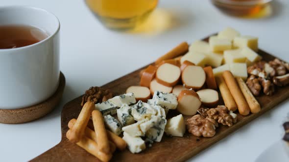 cheese snack with nuts on the board