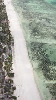 Vertical Video Boats in the Ocean Near the Coast of Zanzibar Tanzania