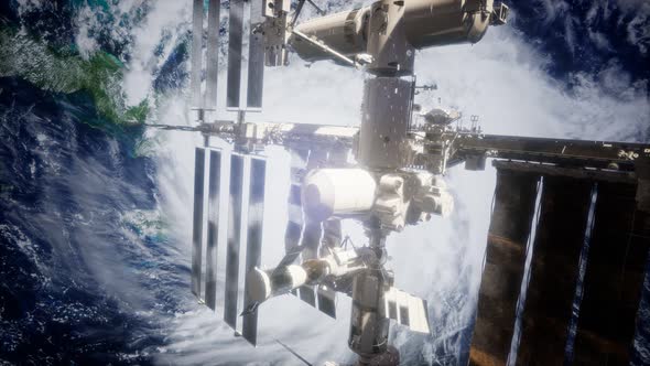 A View of the Earth and a Spaceship. ISS Is Orbiting the Earth