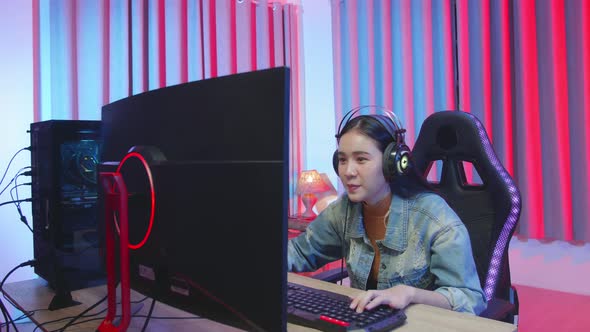 Excited Girl Gamer Playing Video Game On Computer