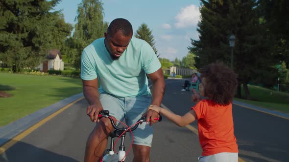 Little Son Forbidding Father Riding Kids Bicycle