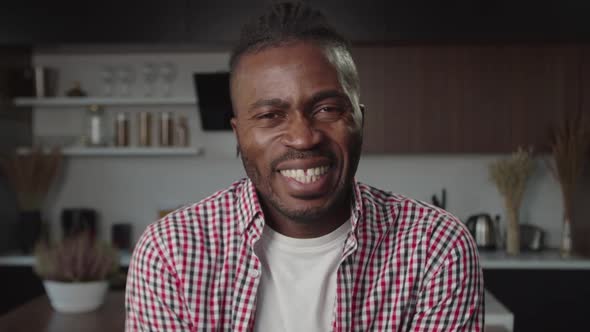 Portrait of Excited Handsome Black Guy Laughing with Infectious Laughter Indoors