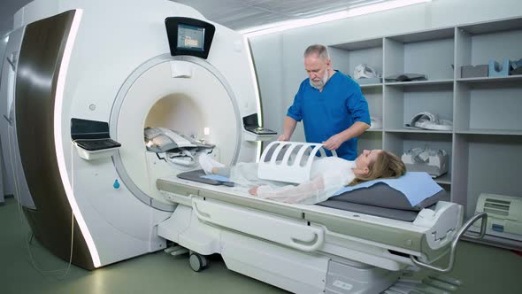 Magnetic Resonance Imaging in the Modern Hospital Adult Man Doctor Performs a Magnetic Tomographic