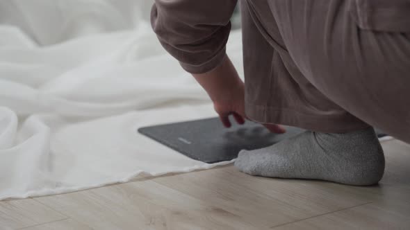 Woman Doing Household Chores Housewife Shortening the Drapes