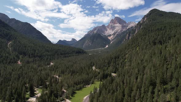 Aerial view of the green mountains forest in Dolomites, Italy