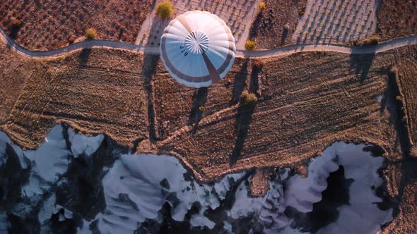 A Balloon is Flying Over Limestone Rock Precipice Filmed From Above By Drone