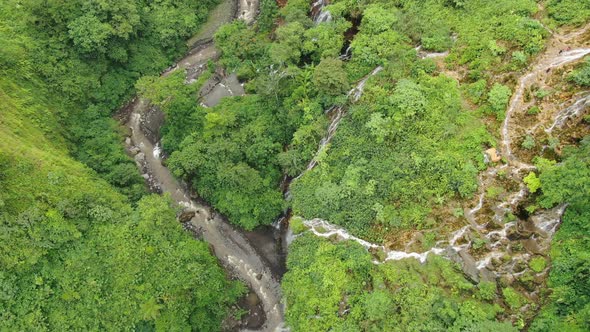 Flying over the Mountain River in Tropical Forest