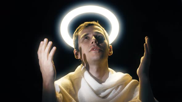 Holy Man with a Halo Above His Head Praying