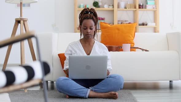 Serious Thinking African American Woman Student Freelancer Sit at Home o Floor Spbi