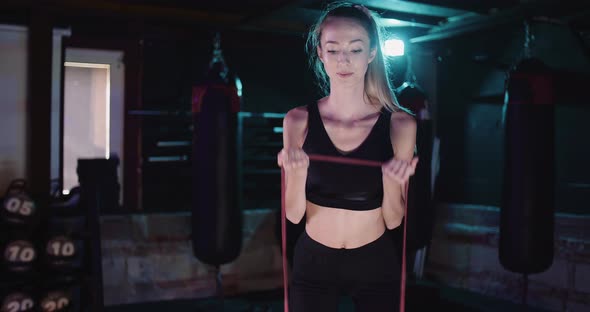 Female Athlete Doing Workout At Health Club