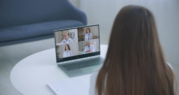 Close Up of Young Female Talk on Video Call Consult with Diverse Doctors Colleagues, Woman Patient