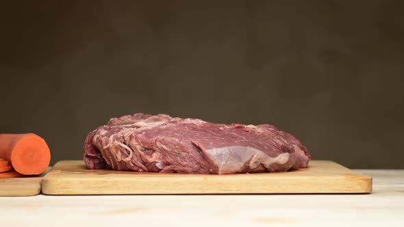 A raw piece of meat replaces the vegetables