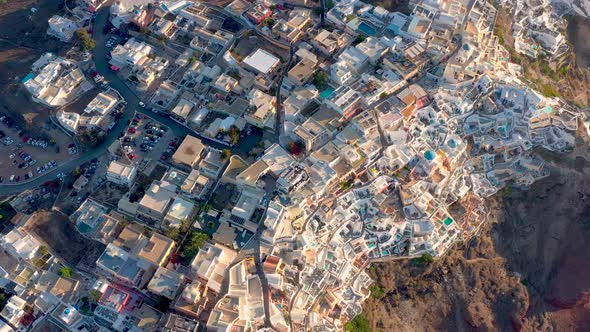 Aerial shot of famous Oia village in Santorini at sunrise in Greece.