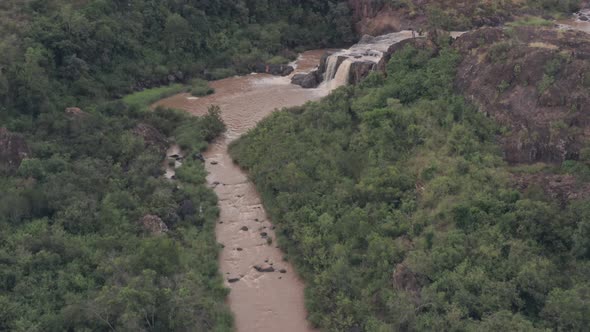 Waterfall in river in Laikipia, Kenya. High aerial drone view of Kenyan landscape