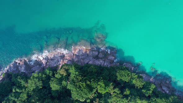 Aerial view Drone camera top down of seashore rocks in ocean Beautiful sea surface Amazing sea waves