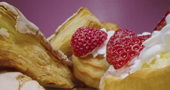 Macro Shot of Donuts with Cream and Strawberry Slices on a Dark Rosy Background Macro Lens Passing