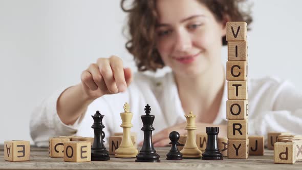 Close Up Of The End Chess Game,  Winner Girl Overturns The King. Shows How The King Falls