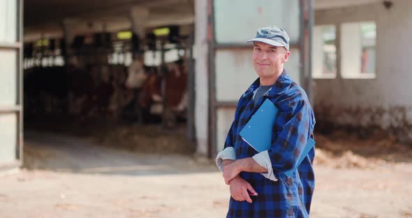 Agriculture Farmer Working on Cowsheed