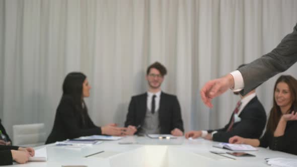 Businessmen shaking hands at a meeting