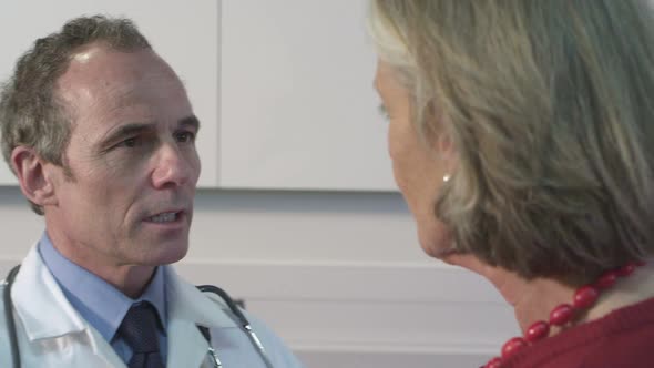 CU Male doctor examining woman eyes in hospital / London, Greater London, United Kingdom.