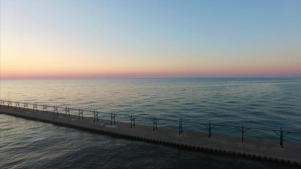 Wide aerial pan across Lake Michigan at sunset