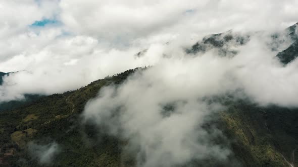 Thick Vapor Surrounding The Natural And Elevated Landscape Of Tungurahua Volcano In Baños de Agua Sa