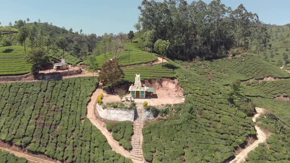 Rolling hills and tea plantations, Munnar, India. Aerial backward 