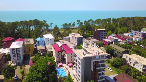 Drone view of town of Kobuleti on Black Sea coast on sunny spring day, Georgia