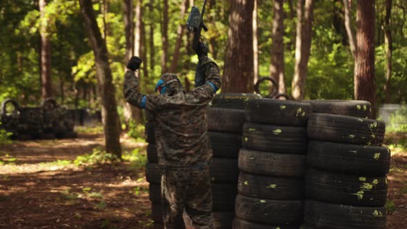 Paintball Battle with Friends Wearing Camouflage to Protect Themselves Elements Leisure Activity