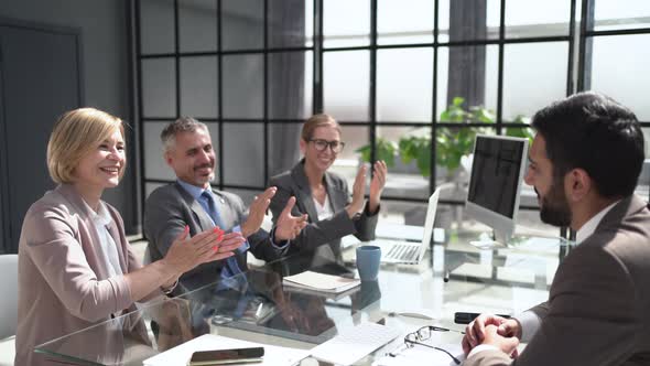 Photo of Happy Business People Applauding at Conference