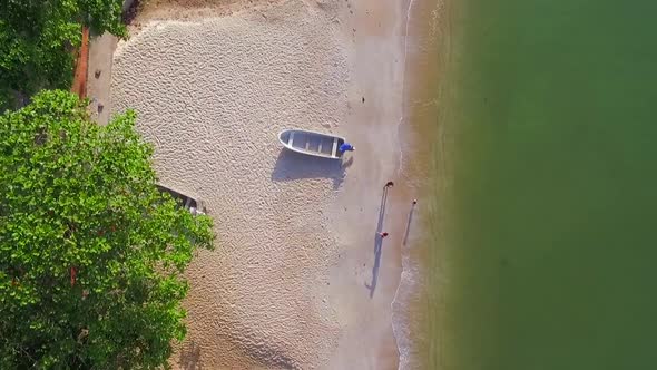 Aerial view above of a calm beach with ripple water, Kep, Cambodia.