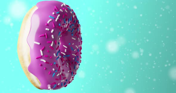 One donut spinning with purple icing and sprinkles on blue background. Pastel colours