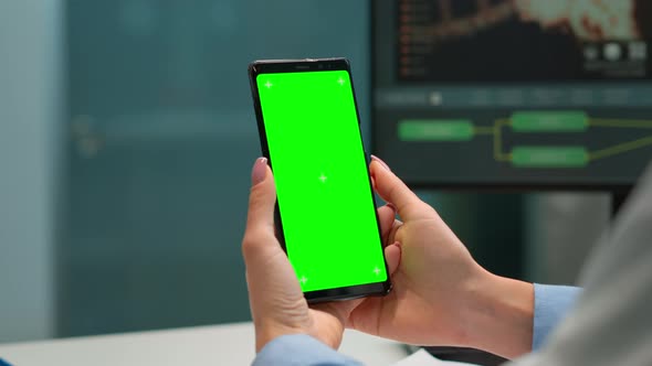 Chemist Checking Patient Results on Smartphone with Green Screen