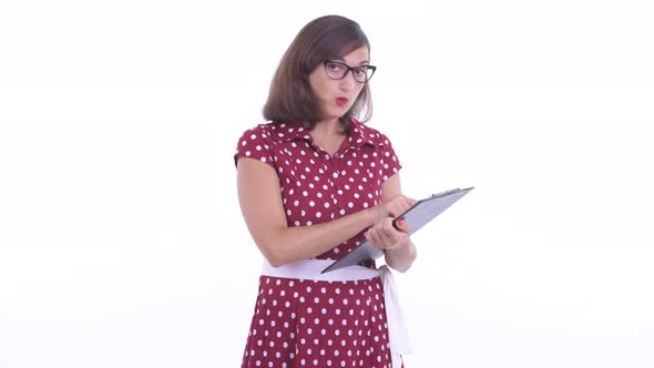 Happy Beautiful Woman with Eyeglasses Talking While Holding Clipboard