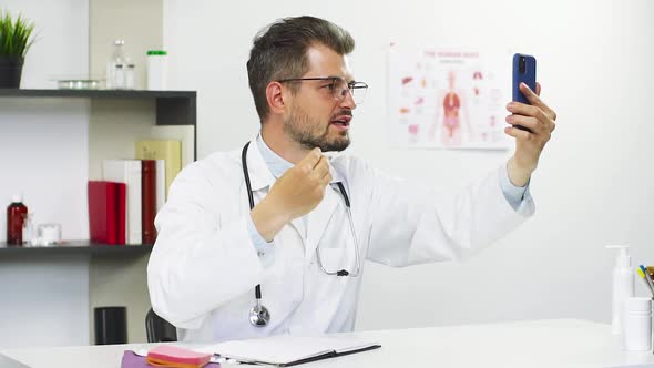 Doctor Discussing with Patient the Symptoms Through Video Call