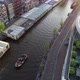 Aerial view of famous canal in Amsterdam, Netherlands, Party boat and typical dutch houses - VideoHive Item for Sale