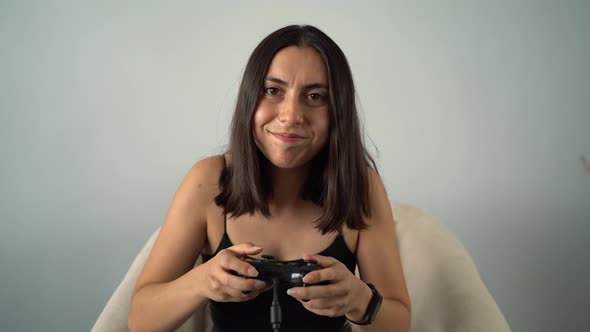 Young Woman Playing Video Game with Joystick 4K