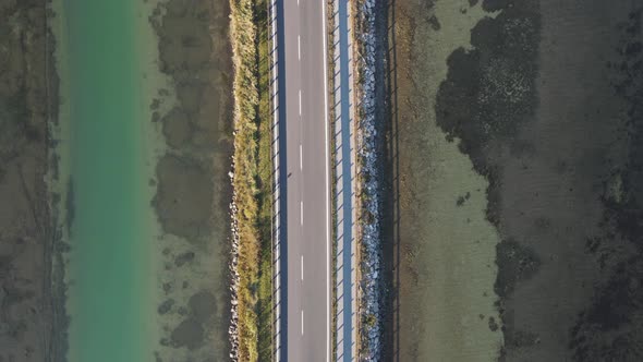 Aerial view of vehicles driving on a beautiful road, Italy.