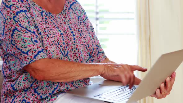 Senior woman doing video call on laptop