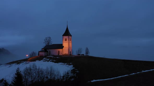 Church of St. Primoz and Felicijan in the Morning. Jamnik, Slovenia. Aerial View