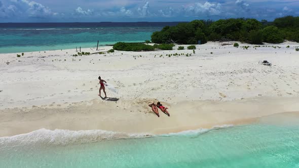 Beautiful ladies posing on paradise island beach time by blue sea with white sandy background of the