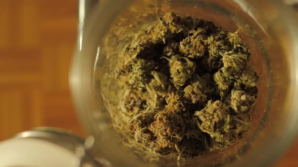 Medical Cannabis, Jar of Dried and Treated Marijuana Buds ,Medical Odorous Cannabis From the Fridge