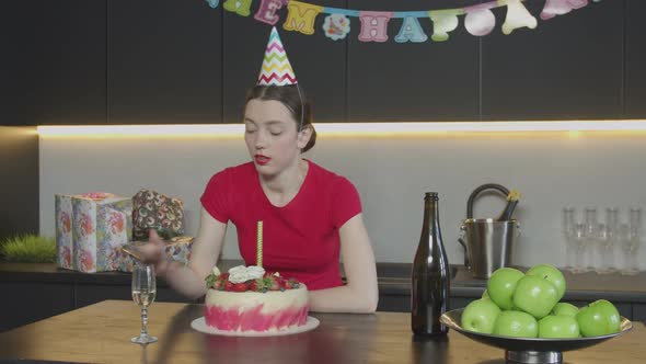 Unhappy Lonely Woman Talking on Phone at Birthday