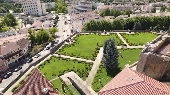 Aerial circling view of gardens and cityscape from Menagem Tower of Chaves castle in Portugal