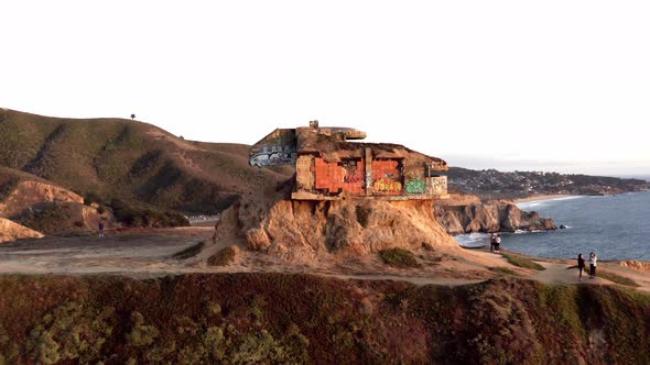 AERIAL: drone, devil's slide bunker sunset, flying away view