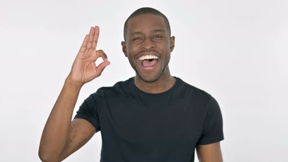 Ok Sign By Young African Man on White Background