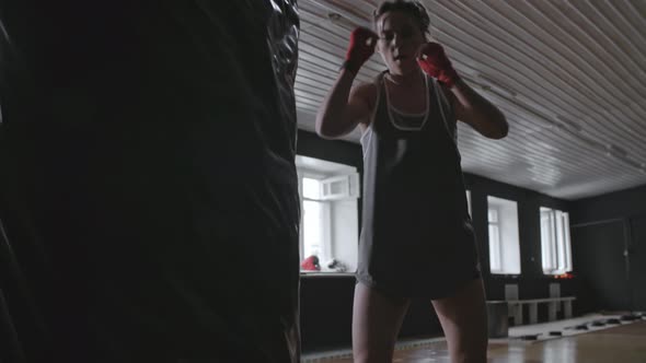 Woman Practicing Kicking Movements alt