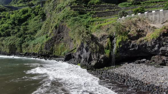 Little waterfall at Seixal black sand volcanic beach, Madeira, Portugal