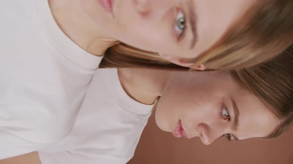 Vertical Portrait of Identical Sisters