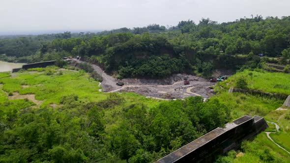 Dam on river by volcanic sand mine near Mount Merapi, Central Java, aerial view